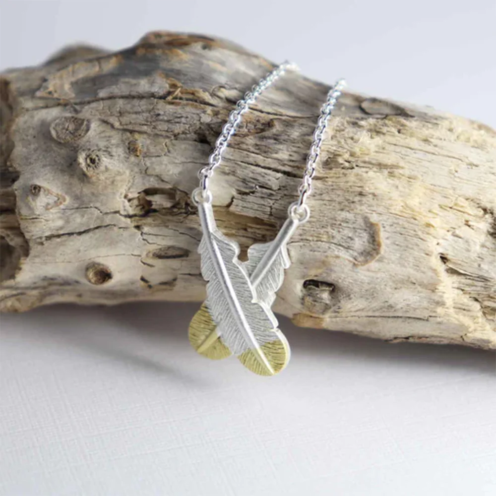 Little Taonga Necklace Crossed Huia Feathers Gold tips on Silver - Image 2